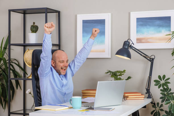 istock Senior businessman working with computer at home office 1310702453