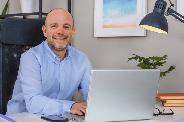 istock Senior businessman working with computer at home office 1310702470