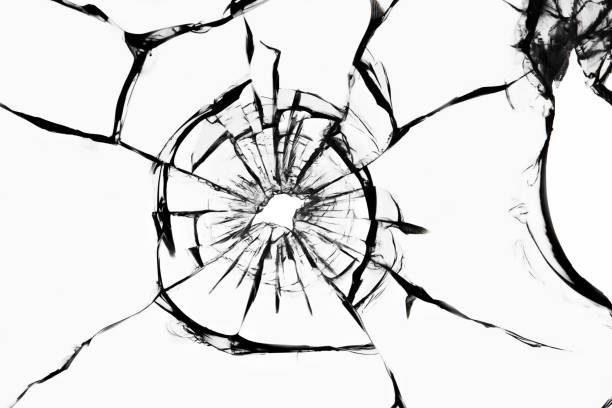 istock Cracked glass on a white background. Broken window. Bullet hole, abstraction for design 1310703146
