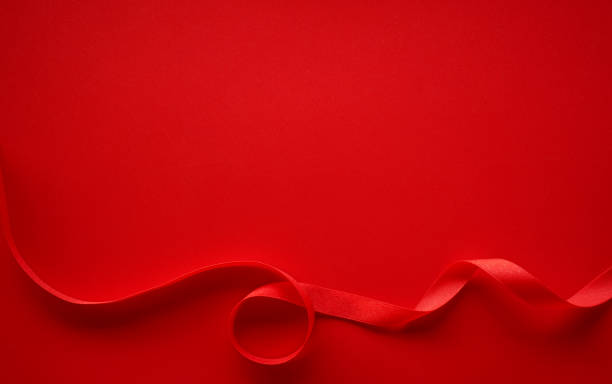 istock Red paper with red satin ribbon frame, Love or Gift background 1310703387