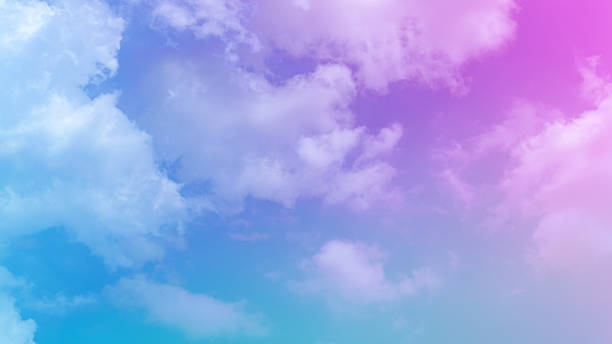istock beauty soft abstract pink sweet pastel with fluffy clouds on sky. multi color rainbow image. fantasy growing sweet light 1310704325