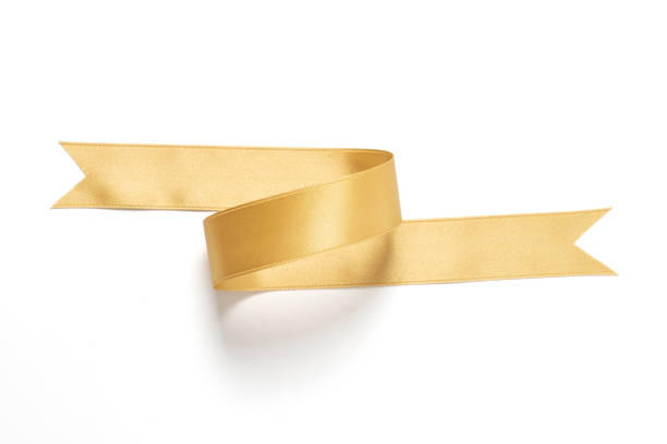 istock A roll gold color ribbon isolated on white background 1310705367