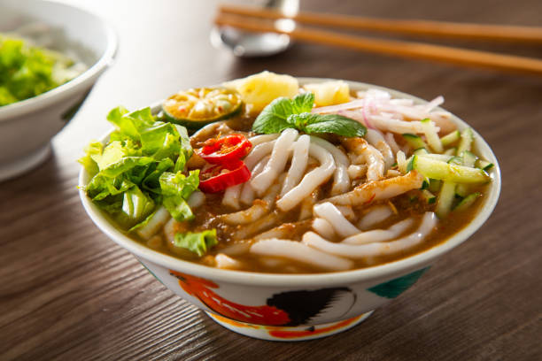 Assam Laksa (Noddle in Tangy Fish Gravy) is a Special Malaysian Popular Food Assam Laksa (Noddle in Tangy Fish Gravy) is a Special Malaysian Popular Food traditional malaysian food stock pictures, royalty-free photos & images