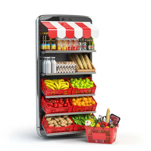 Photo of Grocery food buying online and delivery app concept. Food market in smartphone. Smartphone or mobile phone and shopping basket full of food.