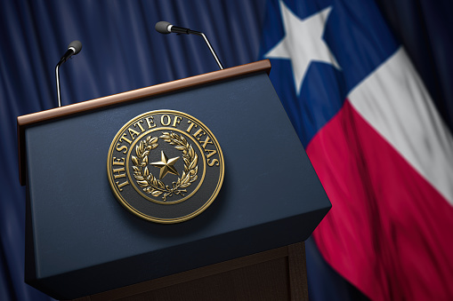 Press conference of governor of the state of Texas concept. Big Seal of the State of Texas on the tribune with flag of USA and Texas state.  3d illustration