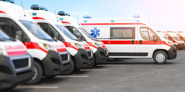 Ambulance cars in a row on a parking. 3d illustration