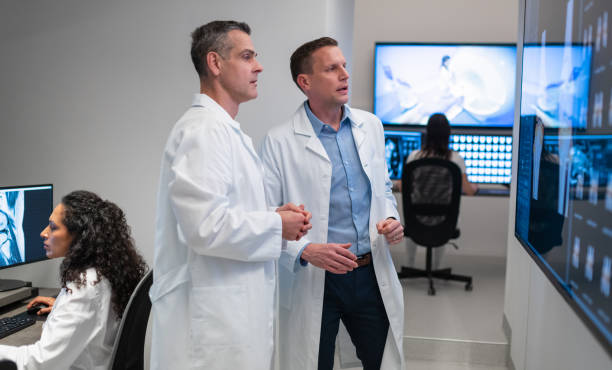 istock Doctors Consult Over An MRI Scan 1310711941
