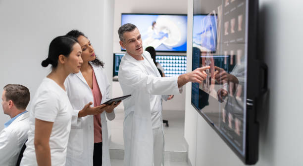 istock Doctors Consult Over An MRI Scan 1310711949