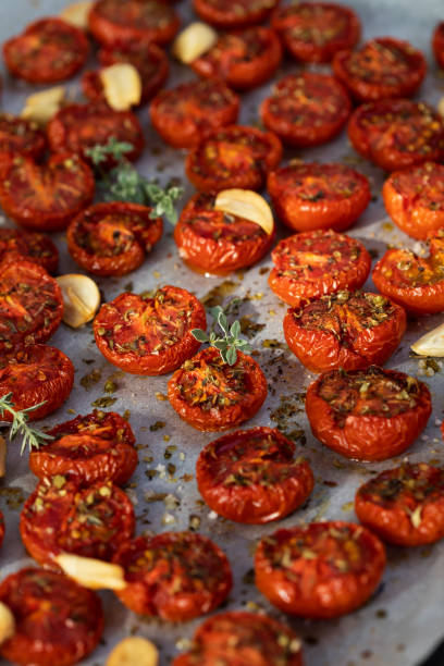 istock Homemade oven dried cherry tomatoes on a tray 1310714338