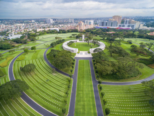 The Manila American Cemetery and Memorial. Located in Fort Bonifacio, Taguig City, Metro Manila. It has the largest number of graves of any cemetery for U.S. personnel killed during World War II The Manila American Cemetery and Memorial. Located in Fort Bonifacio, Taguig City, Metro Manila. It has the largest number of graves of any cemetery for U.S. personnel killed during World War II. Drone View Point taguig stock pictures, royalty-free photos & images