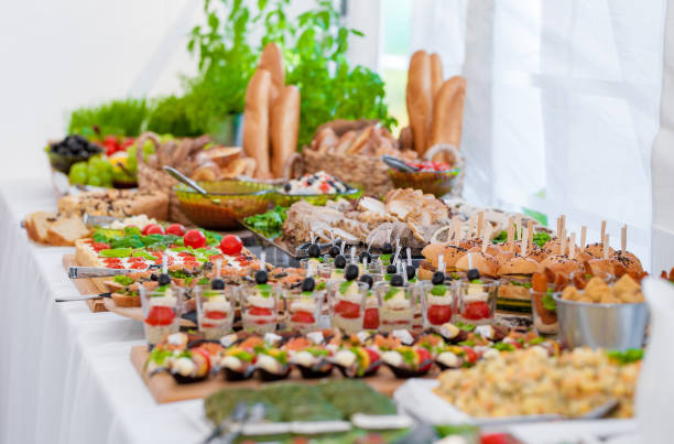 istock Wedding Table With Food. Snacks and Appetizer on the Table. Fish and Raw Meat with Vegetables. 1310717677