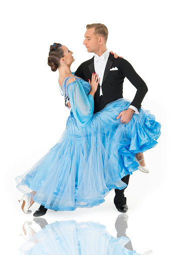 ballroom dance couple in a dance pose isolated on white background. ballroom sensual proffessional dancers dancing walz, tango, slowfox and quickstep. just dance