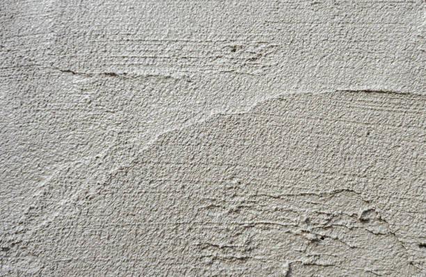 istock Plastering concrete at house wall 1310722091