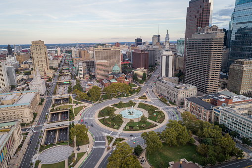 Logan Square and Philadelphia Skyline, Downtown. Pennsylvania, USA. Traffic circle center features a large fountain with whimsical statuary, garden areas with benches.