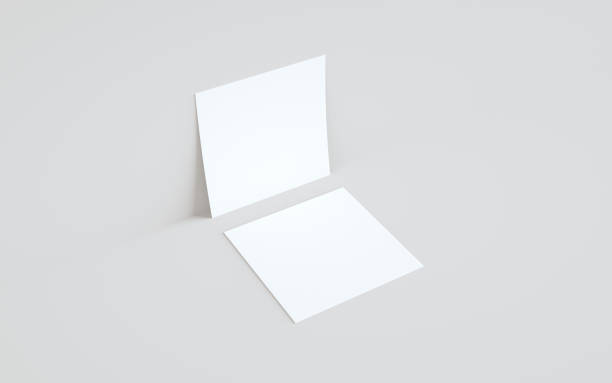 istock Square Flyer Mock-Up - Two Flyers Against Wall Background 1310725960