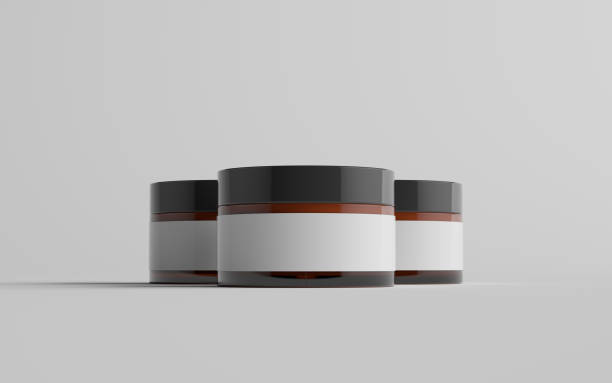 istock Amber Glass Cosmetic Jar Mockup - Three Jars. Blank Label 1310725979