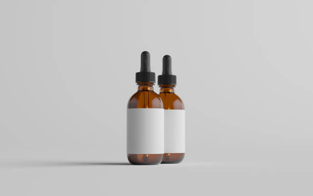 istock Amber Glass Dropper Bottle Mockup - Two Bottles. Blank Label 1310726010