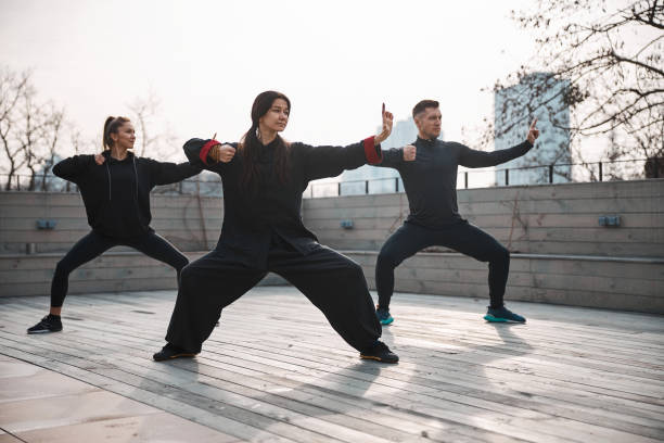 istock Lesson of tai chi form on outside area 1310727347
