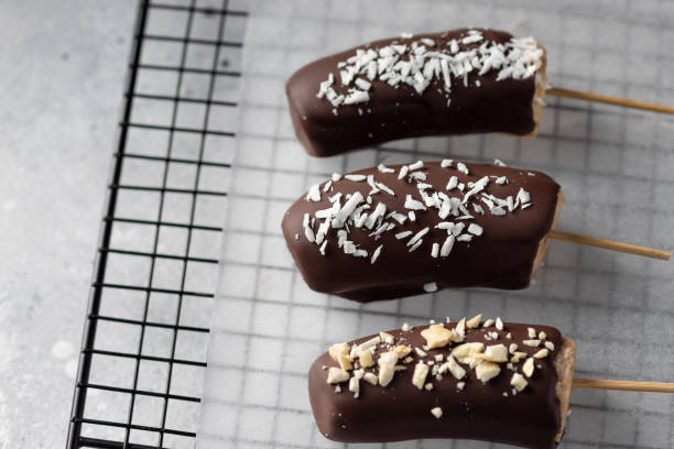 istock Bananas in dark chocolate with toppings 1310728049