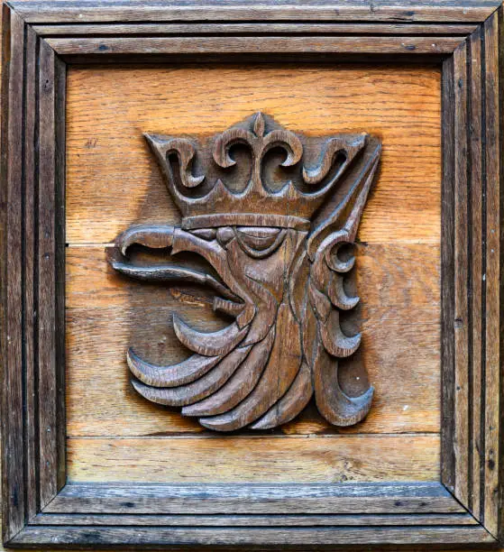 Photo of The emblem of the city of Szczecin in Poland. Wooden sculpture.