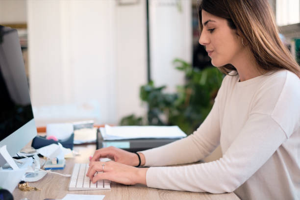 istock A woman working with a computer in a small business. 1310729333