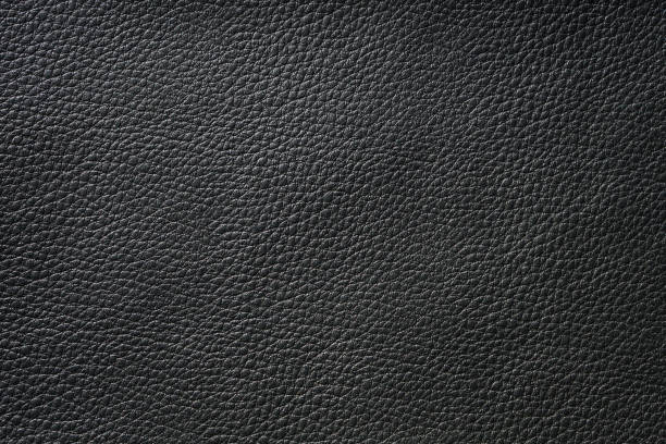istock Close up of black leather texture and background 1310731332