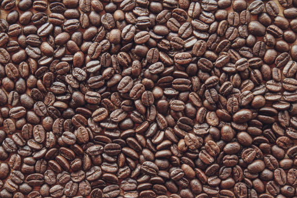istock Close up of roasted coffee beans background 1310731349