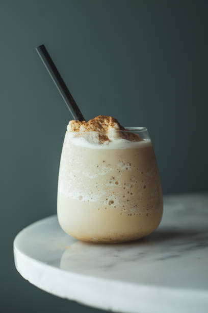 A Glass Of Frothy Frozen Milk Shake With Cinnamon Powder, Pipette A Glass Of Frothy Frozen Milk Shake With Cinnamon Powder, Pipette, dropper photos stock pictures, royalty-free photos & images