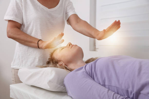 Reiki healing treatment . Energy therapy, alternative medicine concept. Reiki healing treatment . Energy therapy, alternative medicine concept. reiki photos stock pictures, royalty-free photos & images