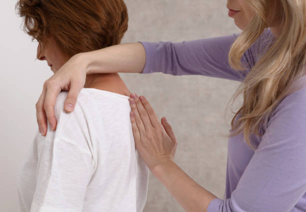 istock Woman suffering from back having chiropractic back adjustment. Osteopathy, Alternative medicine, pain relief concept. 1310734838