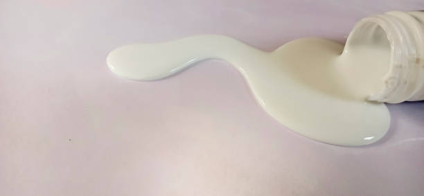 istock Dark white glue from glue can 1310737000