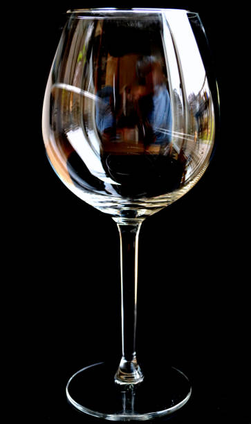 istock Empty large wineglass against black background. 1310737420