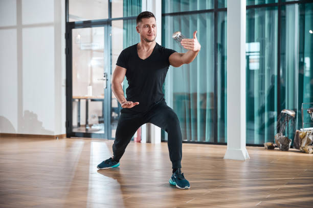 Athletic man practising parting the wild horse mane form