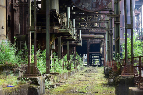 An abandoned and overgrown industrial plant in the landscape park Duisburg-Nord around a decommissioned steelworks, Germany