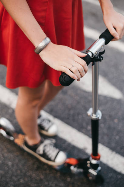 istock Hands holding steering wheek of a kick scooter 1310742588