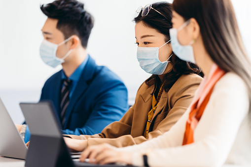 Open Working Environment Asian Business People In Discussion In An Open Working Environment ...