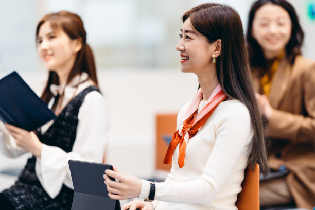 istock Asian business people in discussion in an open working environment. 1310745350