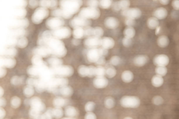 istock Blurred background from polyester sequin fabric texture in gold and silver color. Luxury abstract background. Metal glitter silver cloth background. Gray sequins, sparkling sequined textile 1310745667
