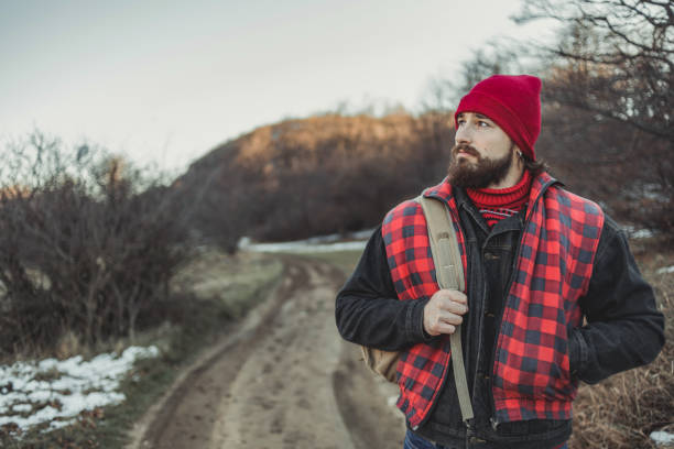 Lumberjack - A lumberjack in the forest works on a daily basis to prepare and cut wood - Coming to work in the woods.