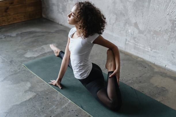 istock Afro american woman doing sport training on exercise mat 1310753218