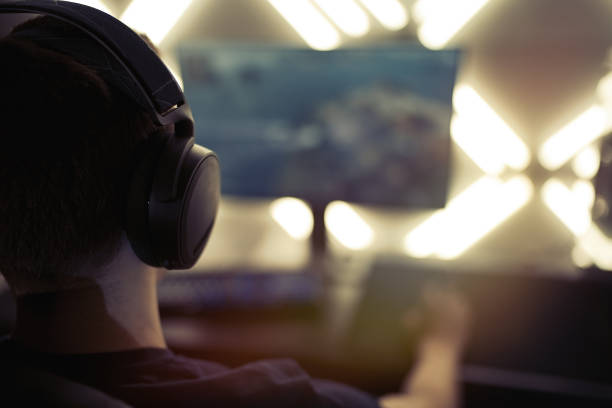 istock Gamer having live stream playing online video game 1310754453