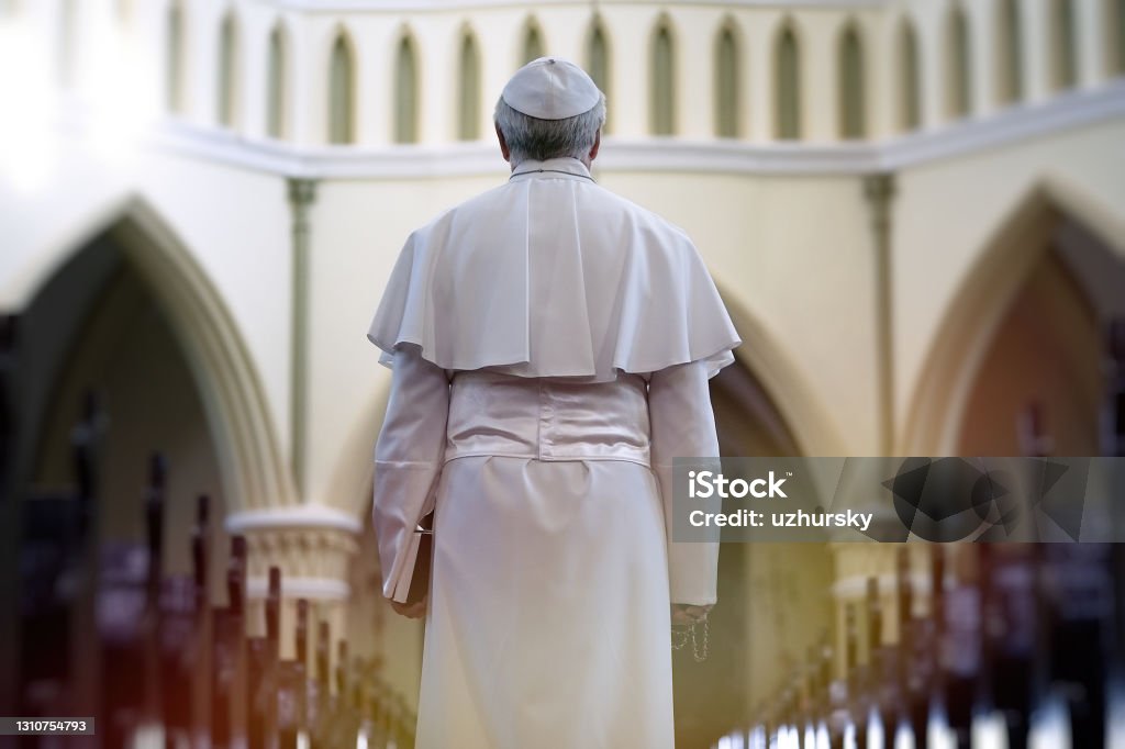 Pope holding a Bible Pope holding a Bible in the church Pope Stock Photo