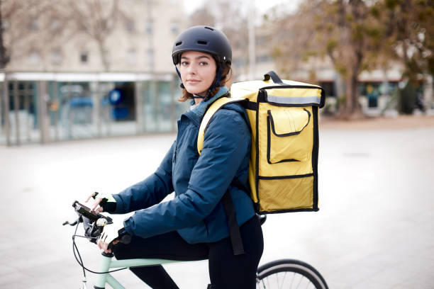 istock One home delivery female looking at camera. 1310759109