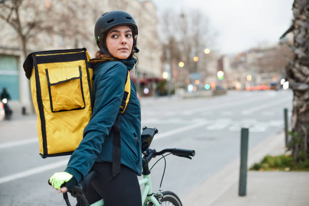 istock A female bicycle messenger in the city 1310759272