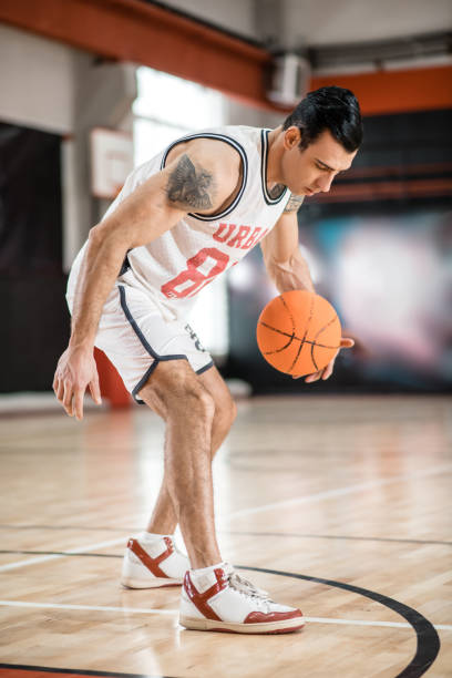 istock Sportsman having a workout before basket-ball game 1310761859