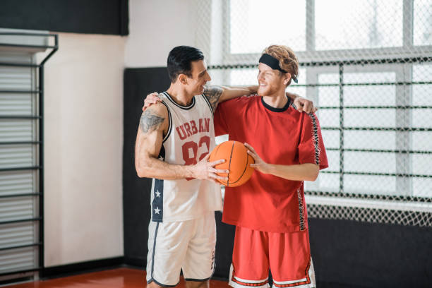 istock Two friends looking contented after the game 1310761933
