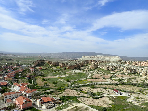 It is the village of Chausin in Cappadocia, Turkey in May .2km from Goreme towards Avanos. It is a panoramic view of the Rose Valley. The setting sun is very beautiful. Until around 1950, people lived here. Chausin is one of the oldest inhabited places in Cappadocia. There are few hotels, but the atmosphere is laid-back. The churches of Chausin are the largest in Cappadocia.