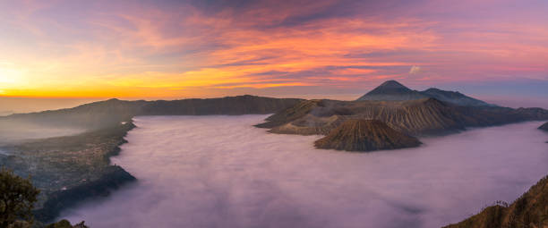 istock Panorama view of Mount Bromo volcano at sunrise in East Java, Indonesia surrounded by morning fog 1310766272