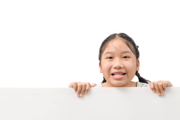 istock Smile girl hold white billboard isolated on white background, 1310767288