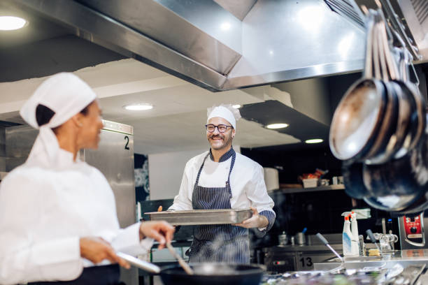 istock Two cooks working at the restaurant kitchen 1310767753